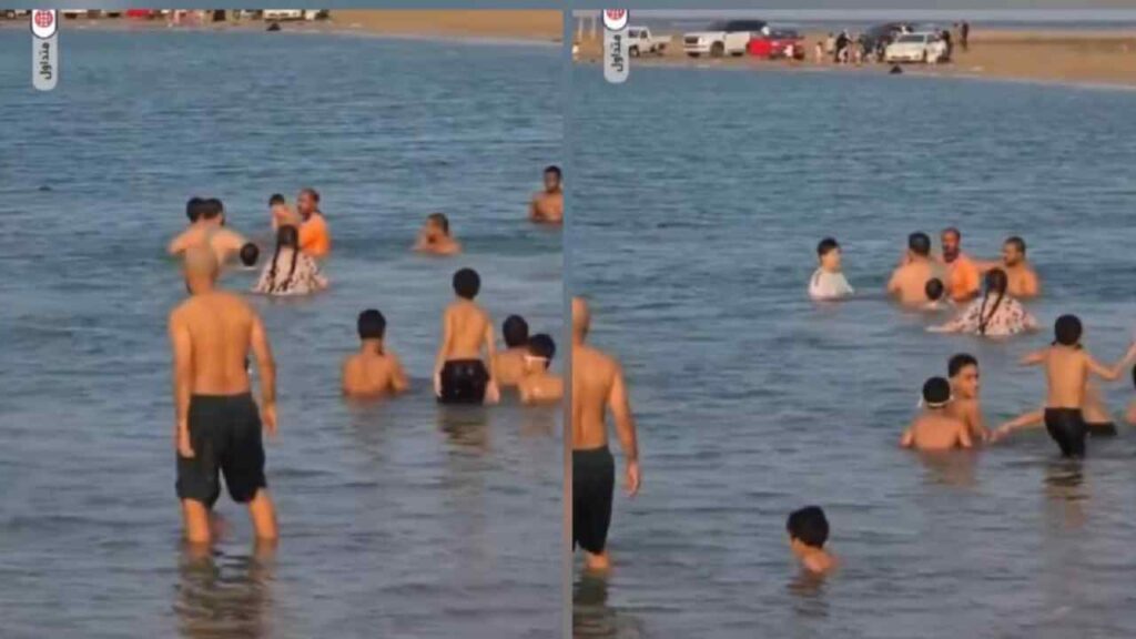 En las imágenes se observa al rescatista desplazarse rápidamente desde la playa hacia el agua. En cuestión de segundos llega hasta donde se encuentra el pequeño y lo saca de la zona de peligro. Captura de pantalla.